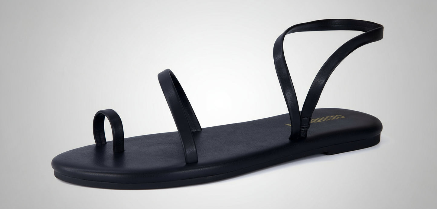 Black sandal with thin straps on a white background