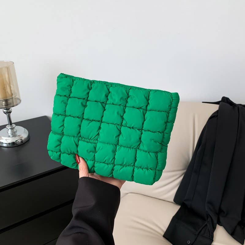 Quilted puffy cosmetic pouch clutch with a zip closure
