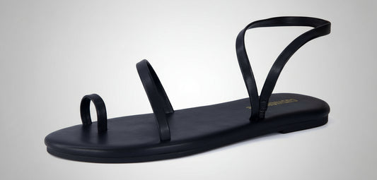 Black sandal with thin straps on a white background